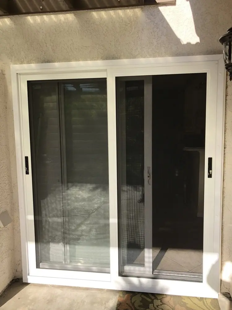 Sliding security screen door with a grid design